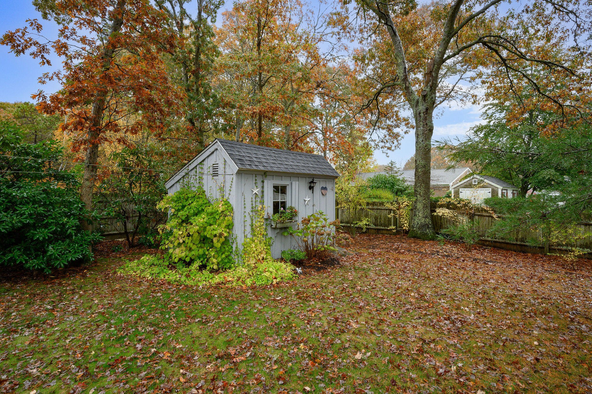 256 Buckskin Path Centerville, MA 02632 - Photo 33 of 38 a front view of a house with garden