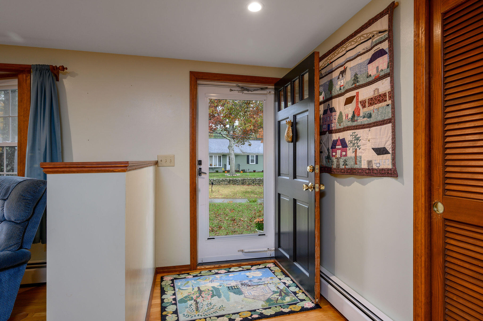 256 Buckskin Path Centerville, MA 02632 - Photo 4 of 38 a view of a hallway with windows and stairs