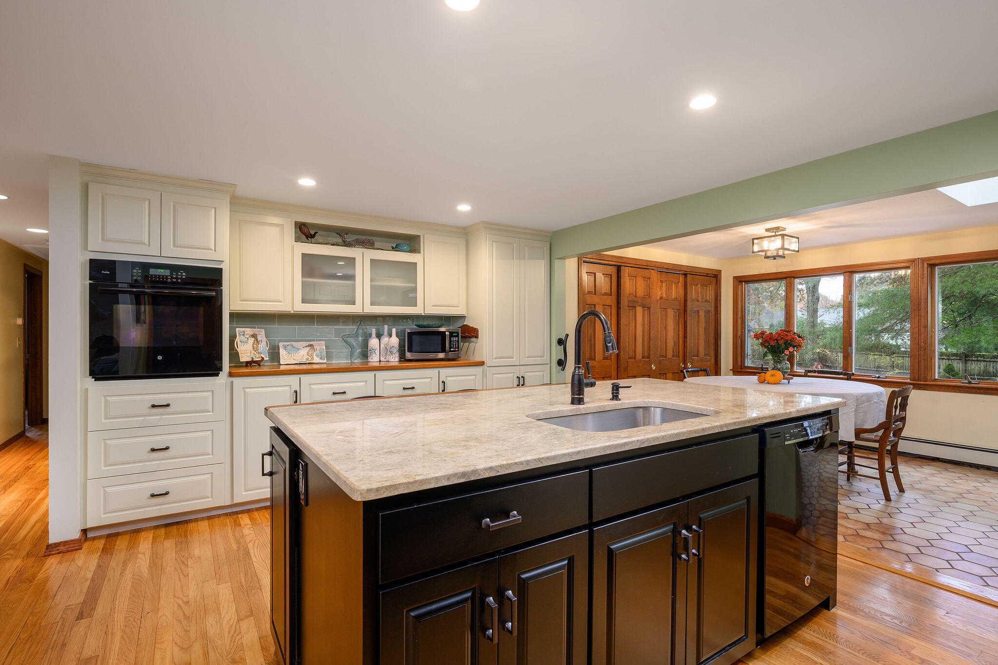 256 Buckskin Path Centerville, MA 02632 - Photo 7 of 38 a kitchen with a sink and cabinets