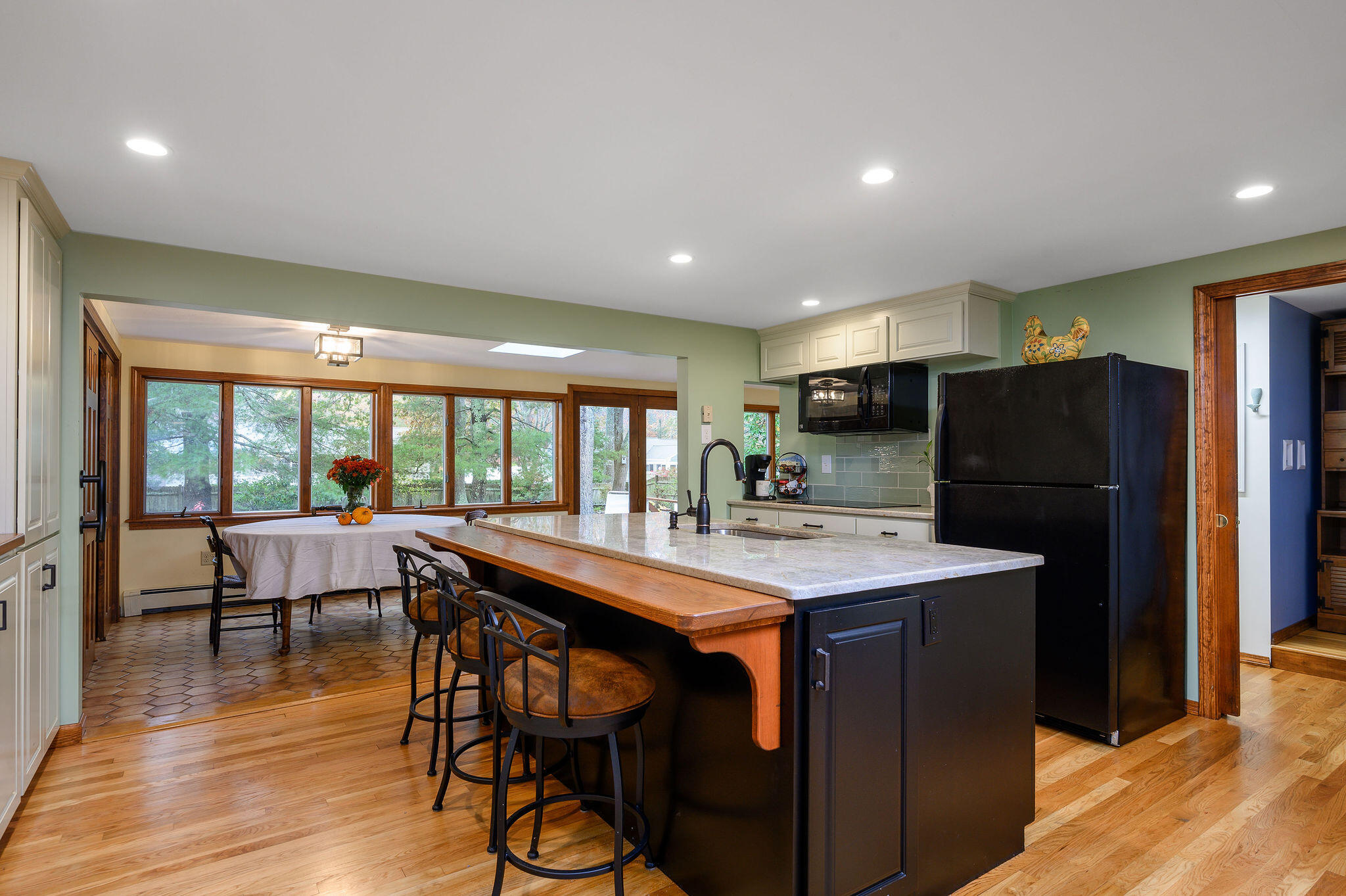 256 Buckskin Path Centerville, MA 02632 - Photo 8 of 38 a view of a dining room with furniture window and wooden floor