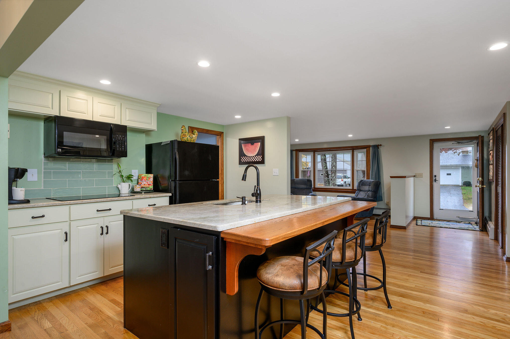 256 Buckskin Path Centerville, MA 02632 - Photo 9 of 38 a large kitchen with a table and chairs