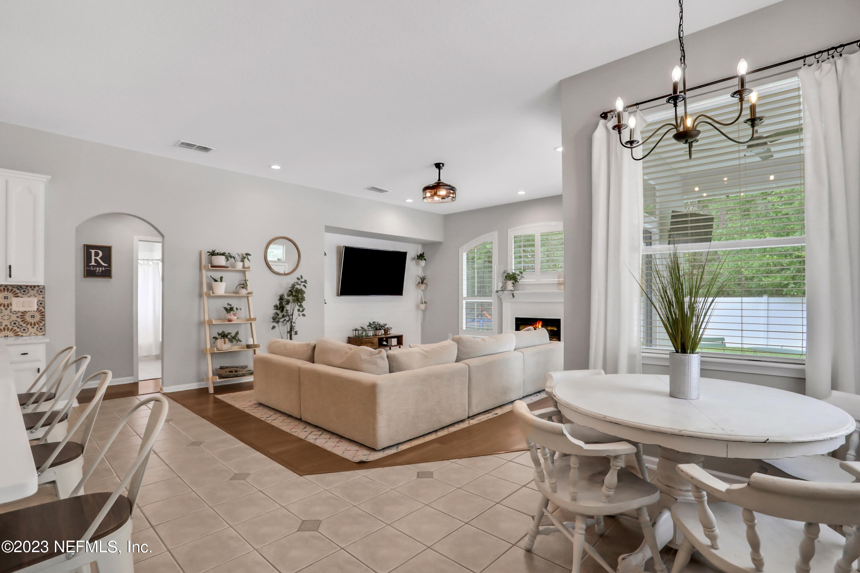 4100 Lonicera Loop St. Johns, FL 32259 - Photo 11 of 65 a living room with furniture a flat screen tv and a large window