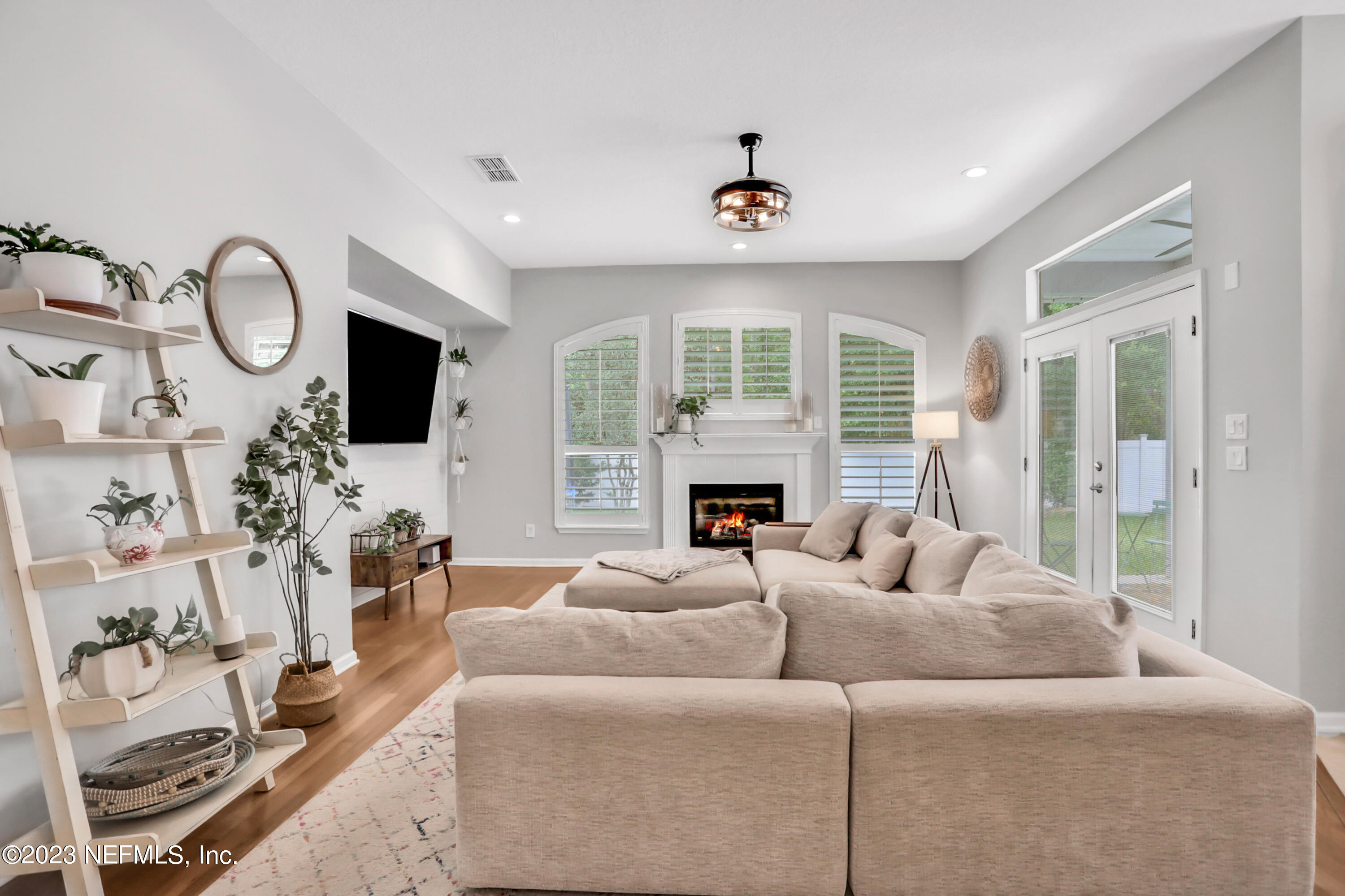 4100 Lonicera Loop St. Johns, FL 32259 - Photo 18 of 65 a living room with furniture fireplace and a large window