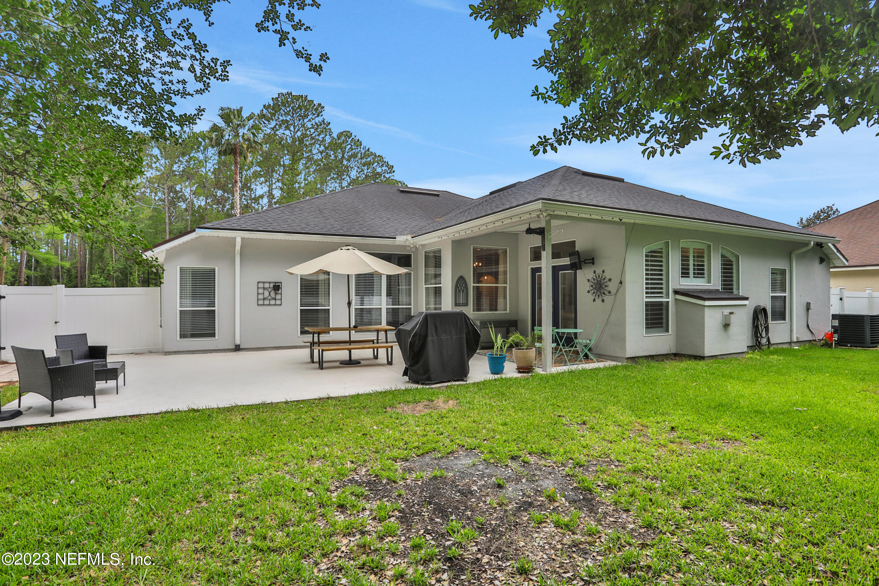 4100 Lonicera Loop St. Johns, FL 32259 - Photo 35 of 65 a front view of a house with patio and garden