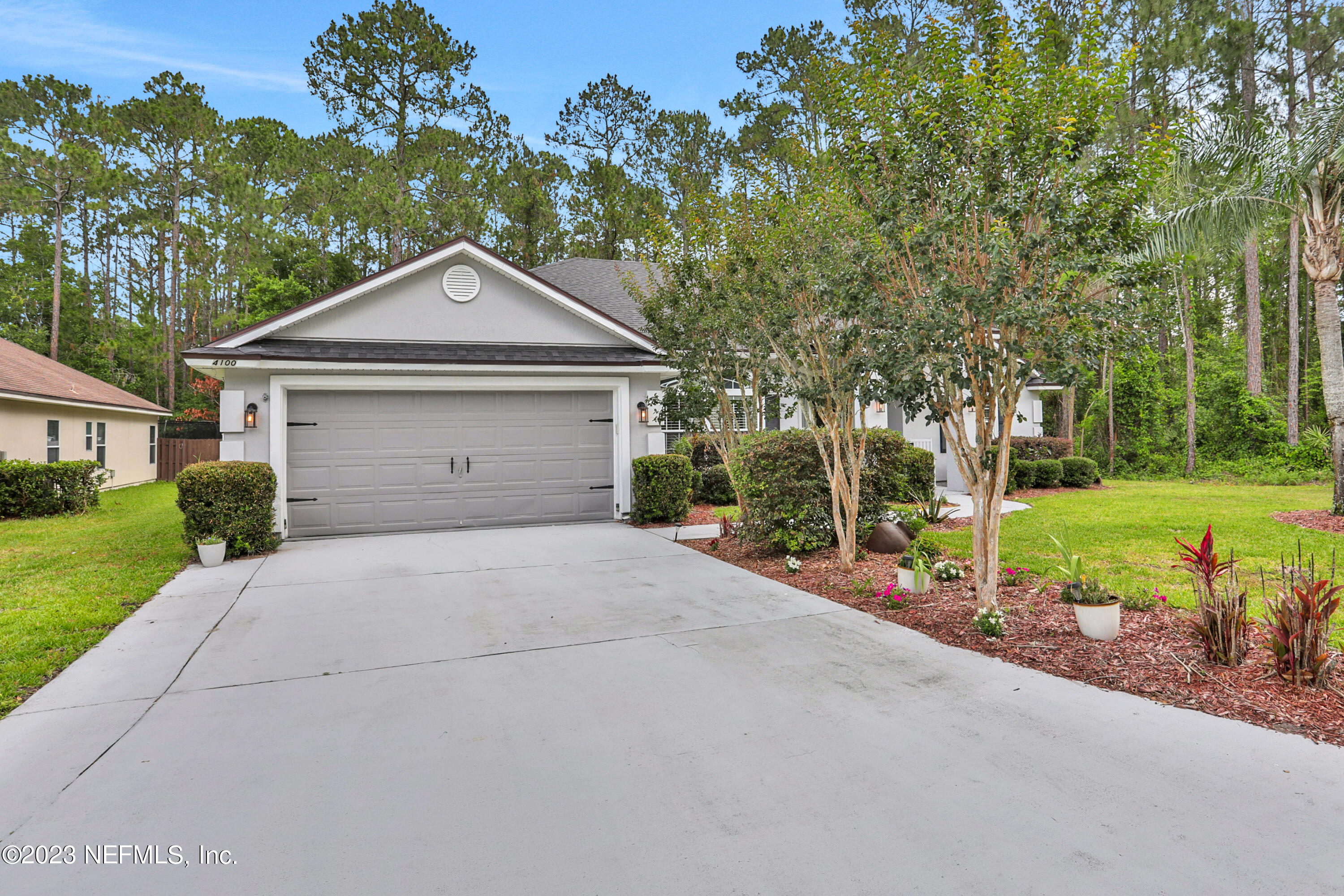 4100 Lonicera Loop St. Johns, FL 32259 - Photo 5 of 65 a front view of a house with a yard and garage
