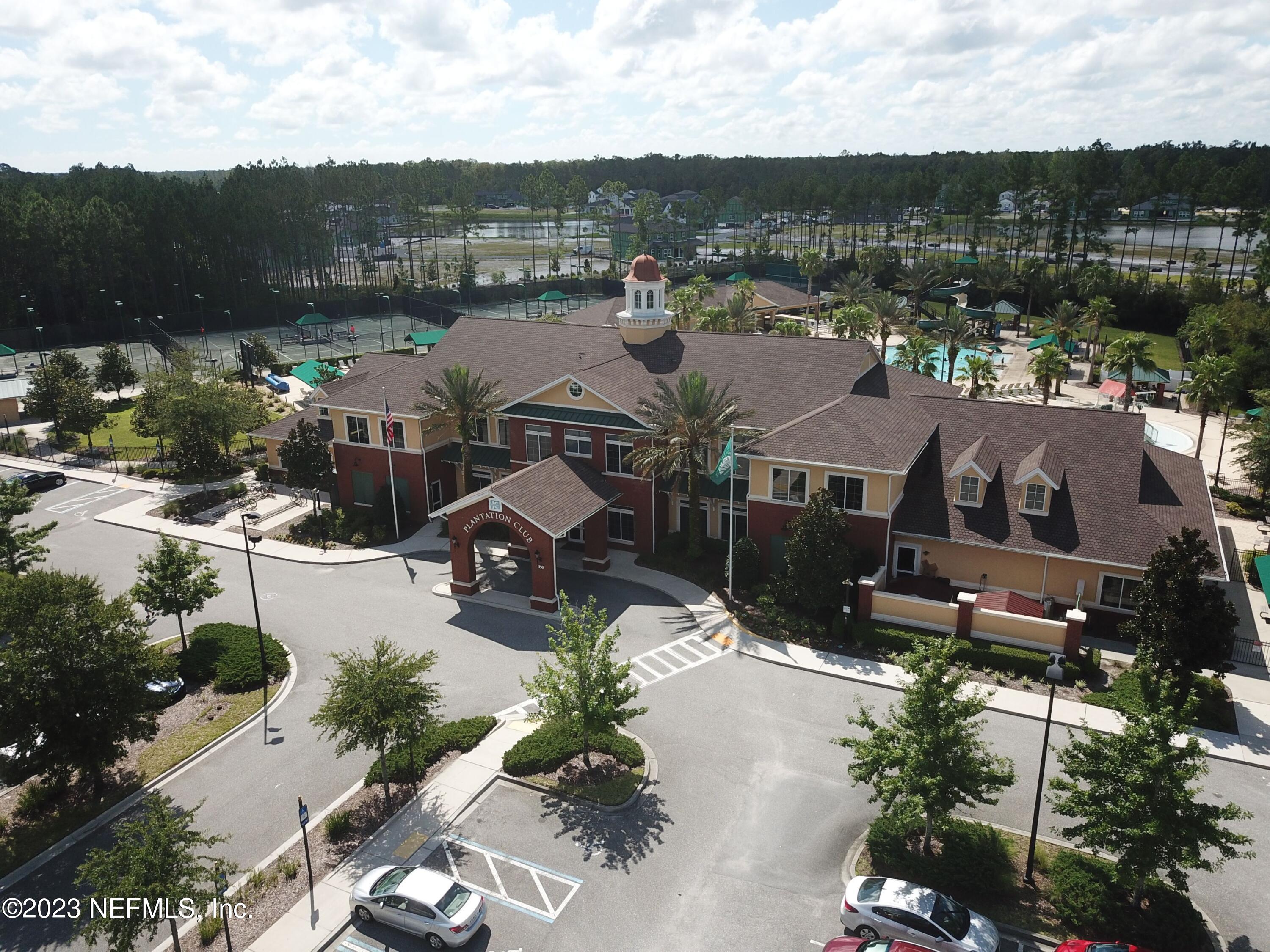 4100 Lonicera Loop St. Johns, FL 32259 - Photo 58 of 65 an aerial view of a house with a garden and lake view