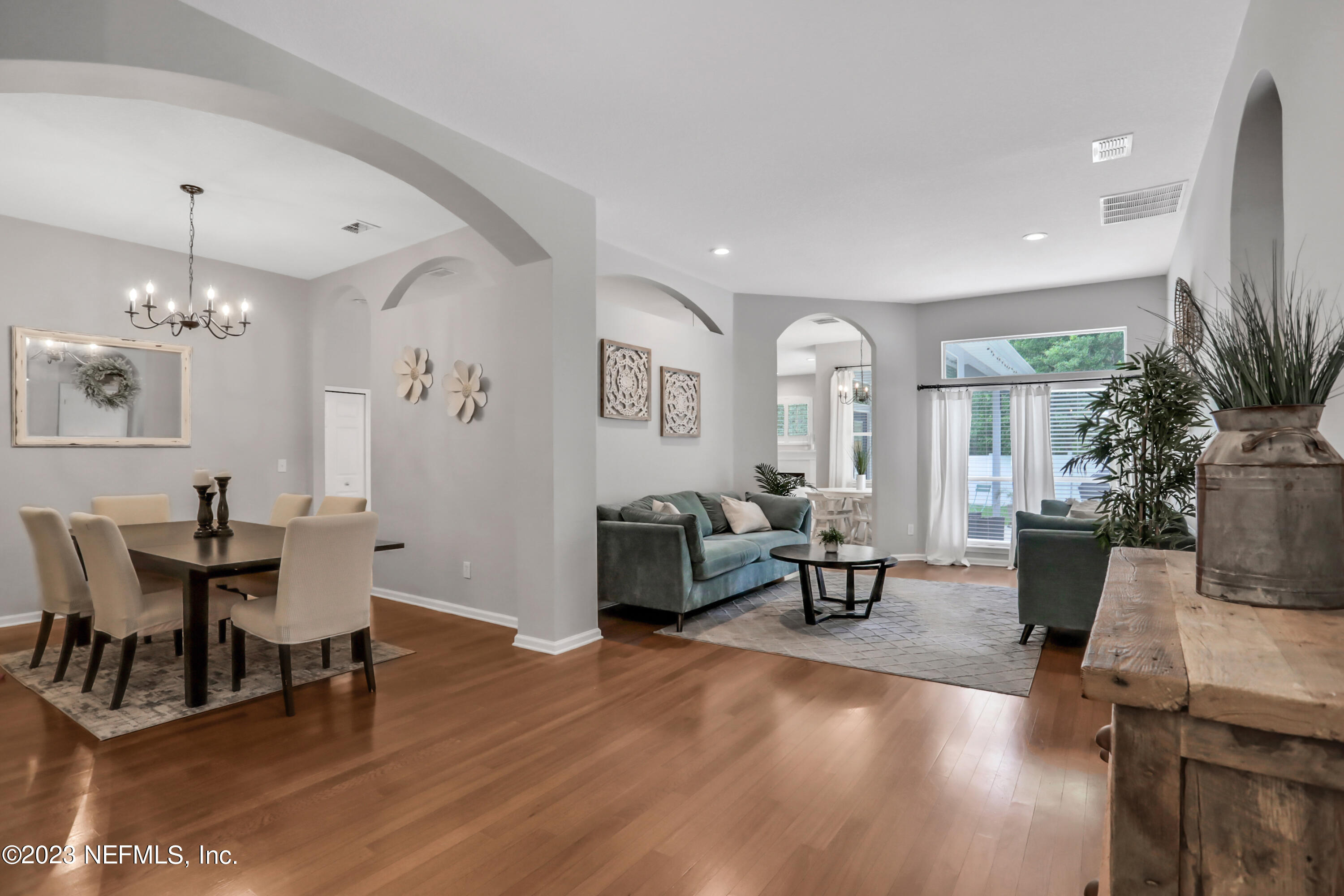 4100 Lonicera Loop St. Johns, FL 32259 - Photo 6 of 65 a living room with furniture and a chandelier