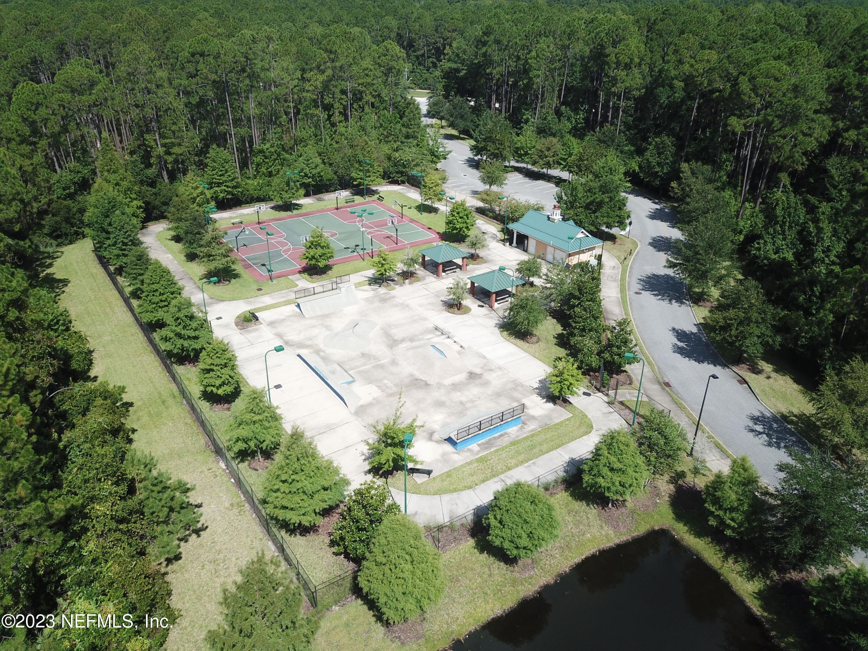 4100 Lonicera Loop St. Johns, FL 32259 - Photo 65 of 65 an aerial view of a house with a yard and greenery