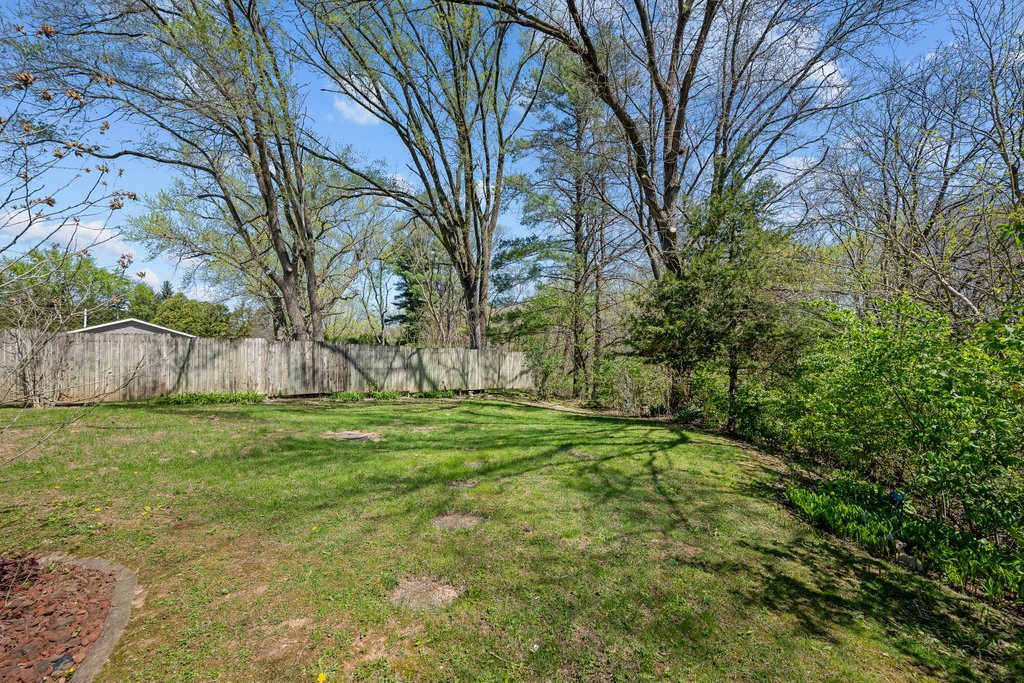 11213 22nd Street Milan, IL 61264 - Photo 33 of 36 a big yard with lots of green space and trees