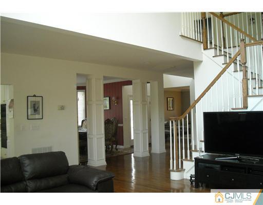 1 Barton Way Basking Ridge, NJ 07920 - Photo 5 of 20 a living room with furniture and a flat screen tv