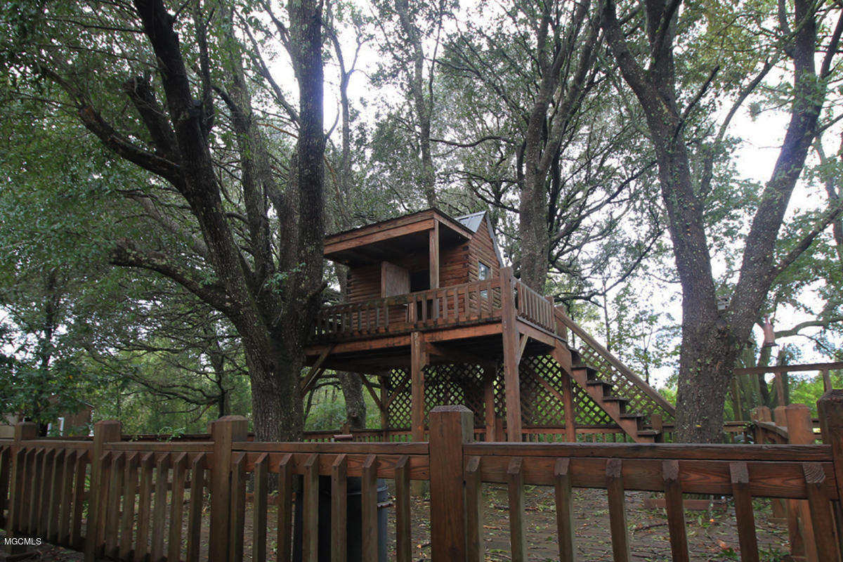2174 Cooks Corner Road Lucedale, MS 39452 - Photo 27 of 32 Playhouse and Deck
