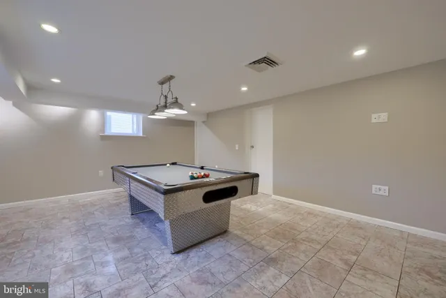 a kitchen with granite countertop a stove and a sink