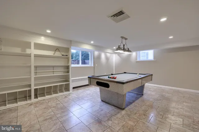 a living room with granite countertop furniture a chandelier and a rug