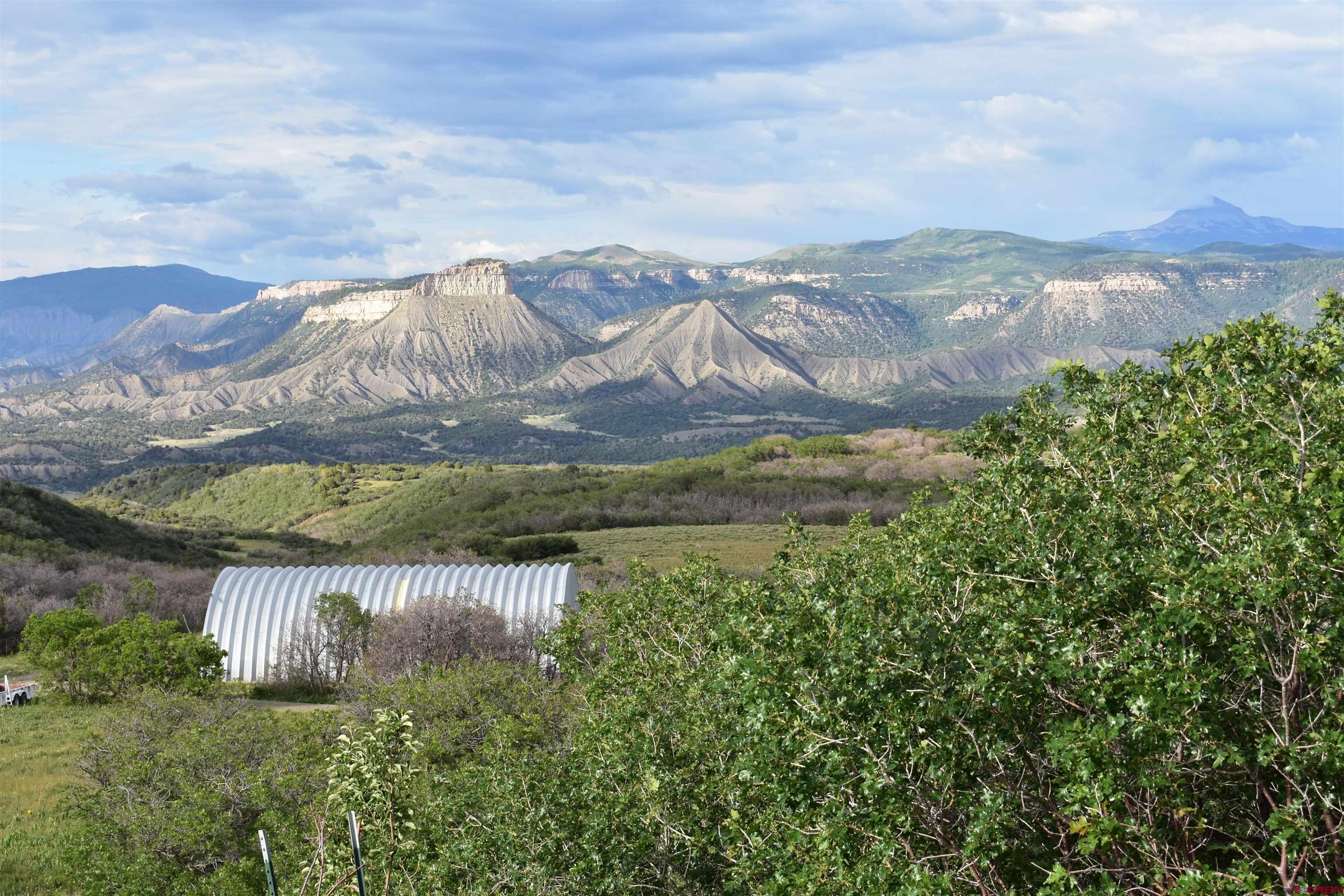 9723 Road 27.4 Dolores Co 81323 Norwood, CO 81423 - Photo 13 of 35 a view of a lake with mountains in the background