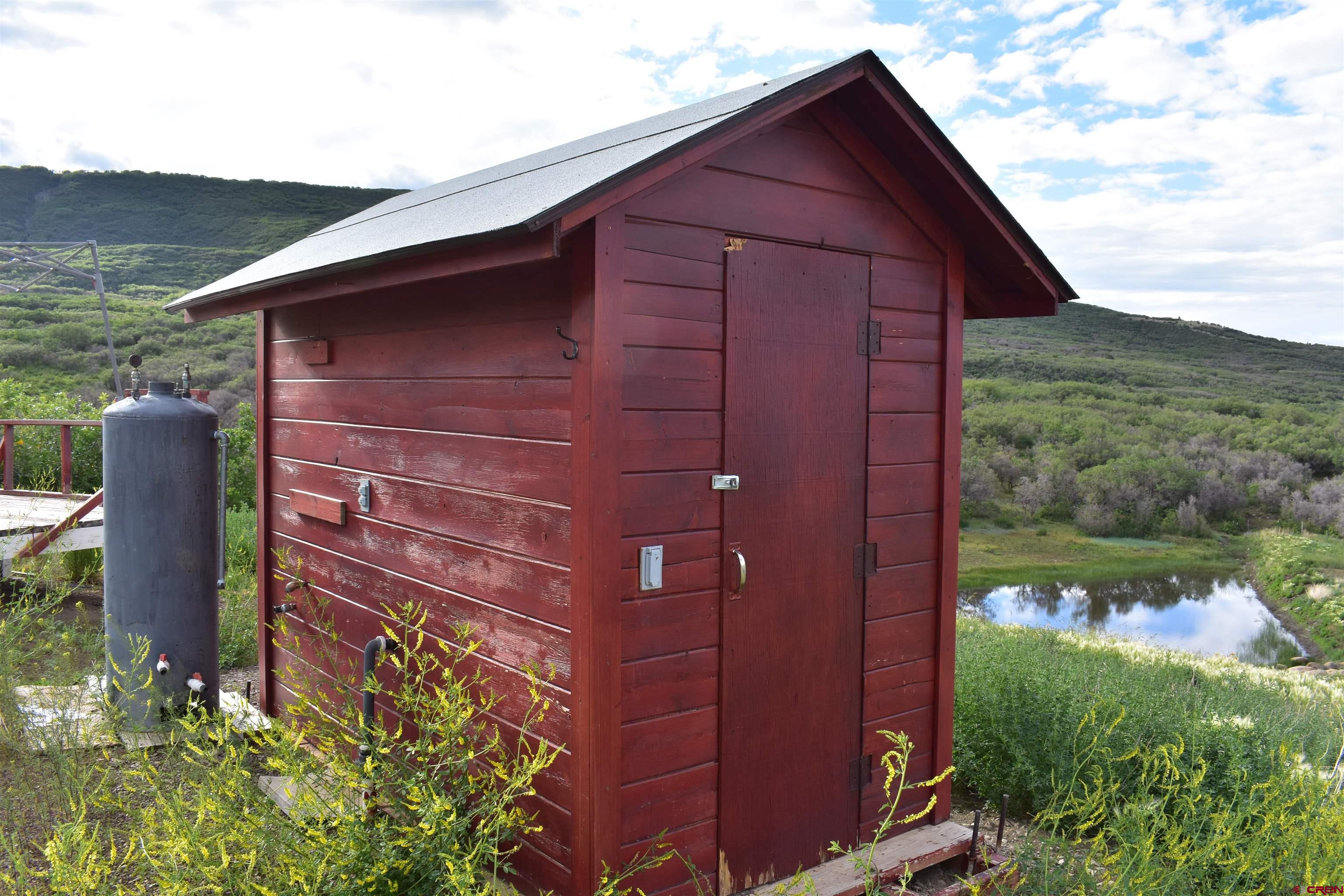 9723 Road 27.4 Dolores Co 81323 Norwood, CO 81423 - Photo 15 of 35 a view of a small house with a yard