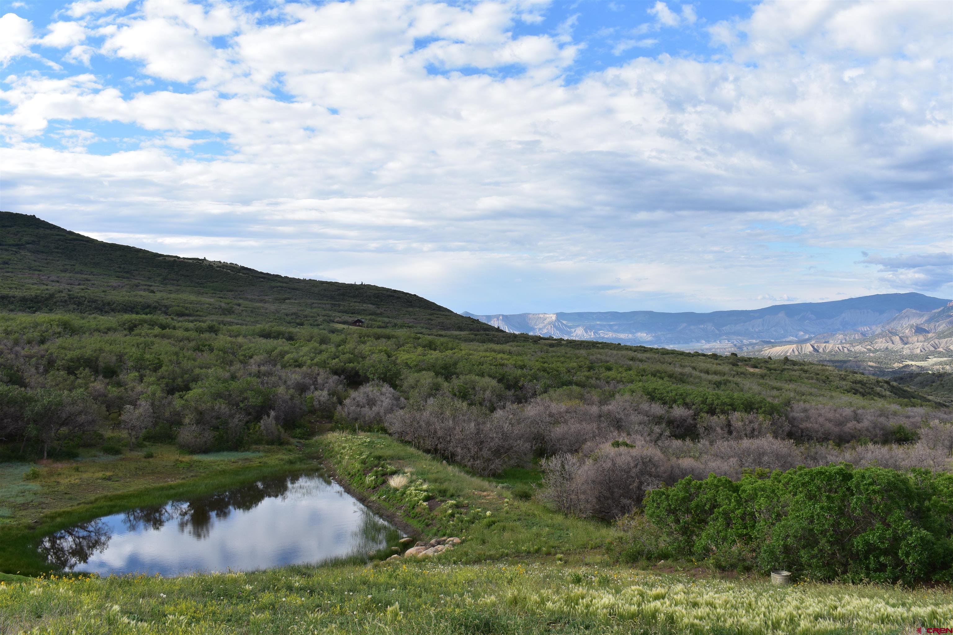 9723 Road 27.4 Dolores Co 81323 Norwood, CO 81423 - Photo 17 of 35 a view of a lake with mountains in the background
