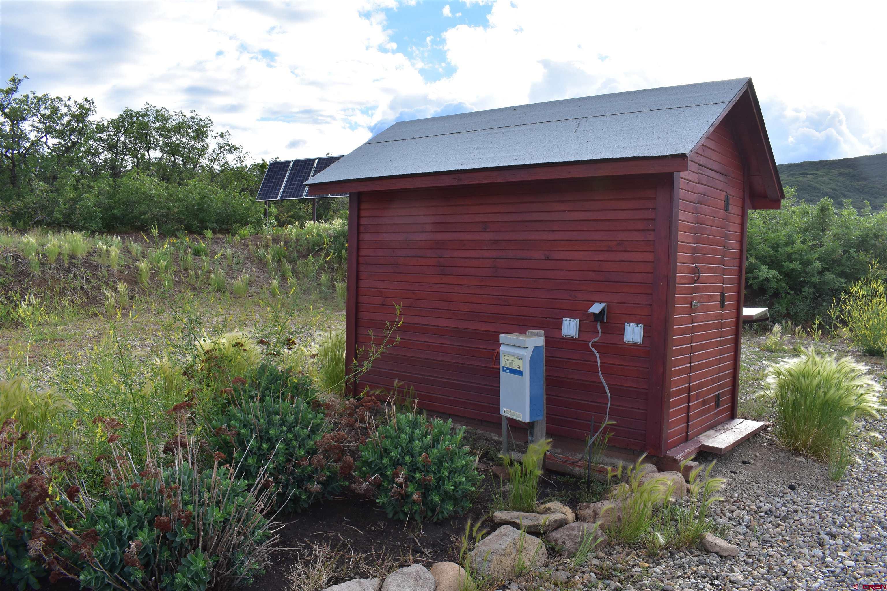 9723 Road 27.4 Dolores Co 81323 Norwood, CO 81423 - Photo 19 of 35 a view of a brick house next to a yard