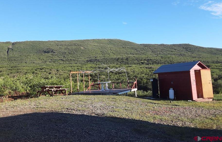 9723 Road 27.4 Dolores Co 81323 Norwood, CO 81423 - Photo 28 of 35 a view of a house with a yard