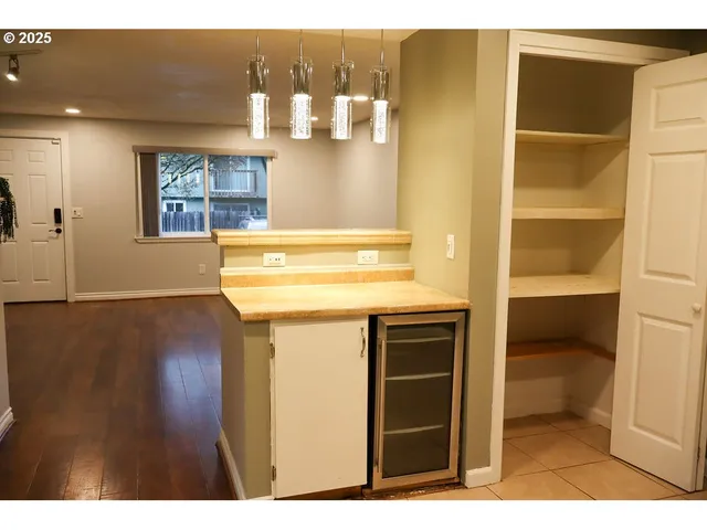 a view of kitchen and wooden floor