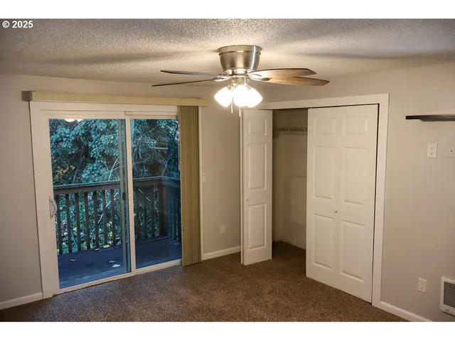 a view interior of a house an entryway and chandelier fan