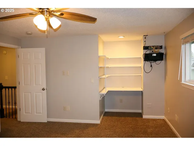 a view of entryway and kitchen