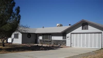12744 Pocono Road Apple Valley, CA 92308 - Photo 1 of 1 a front view of a house with yard