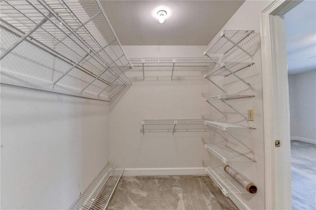 2859 Village Court Gainesville, GA 30506 - Photo 18 of 27 a view of a room with racks on the wall