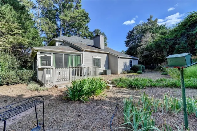 a view of a lake with a house in a background