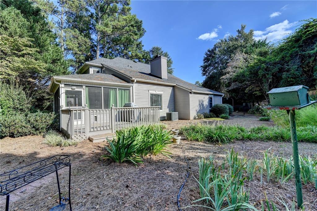 2859 Village Court Gainesville, GA 30506 - Photo 26 of 27 a front view of a house with garden