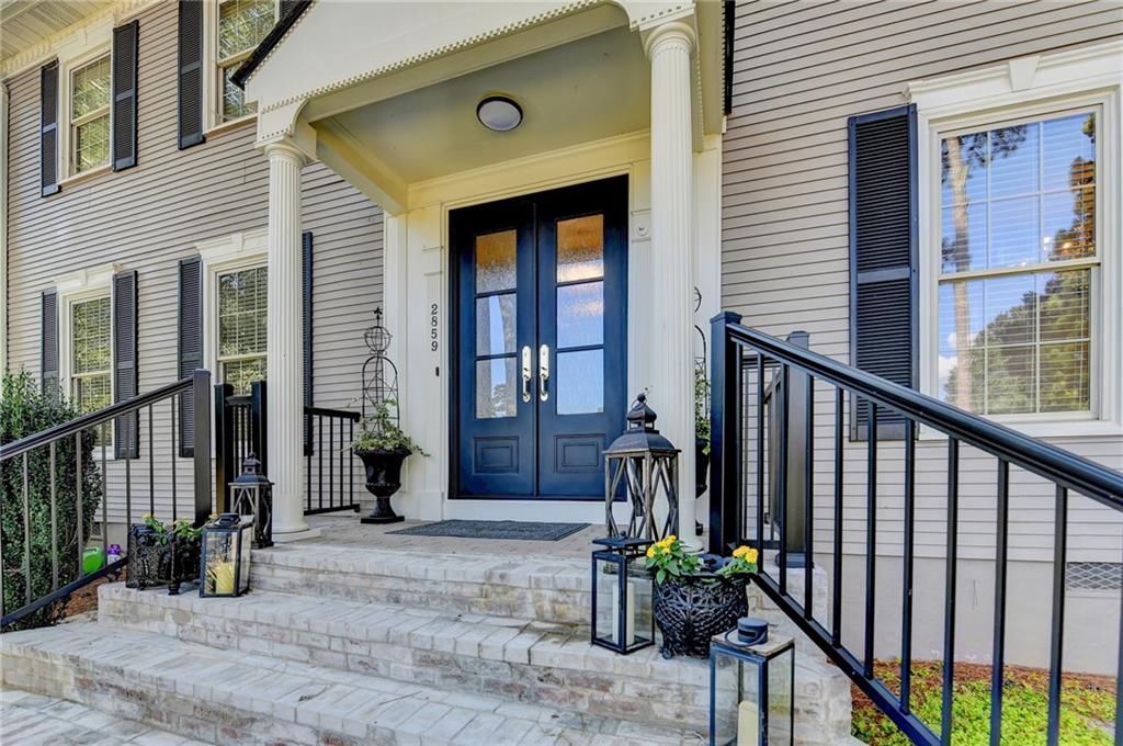 2859 Village Court Gainesville, GA 30506 - Photo 3 of 27 a view of a house with many windows and plants