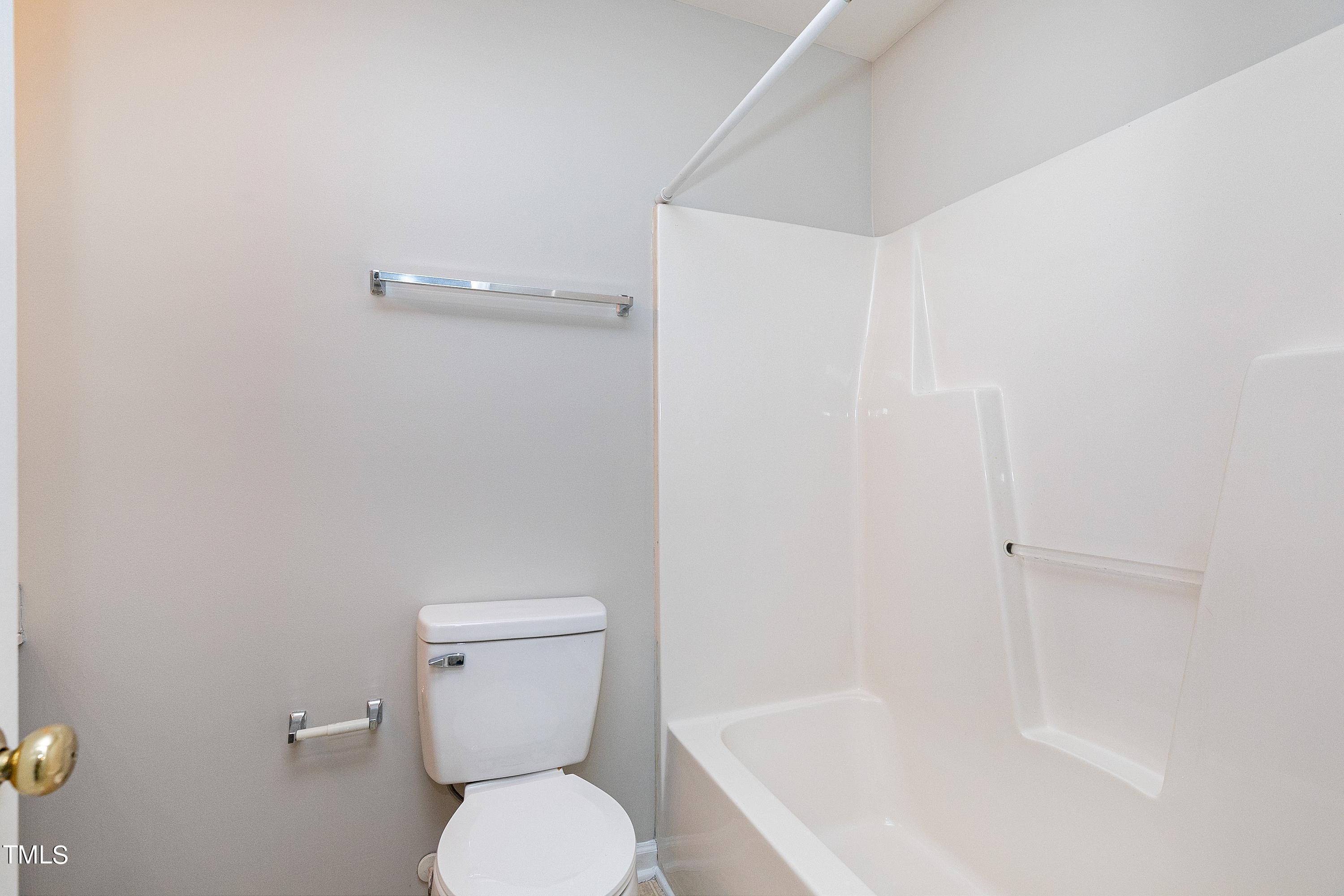 13 Red Lane Raleigh, NC 27606 - Photo 21 of 28 a white toilet sitting next to a bath tub