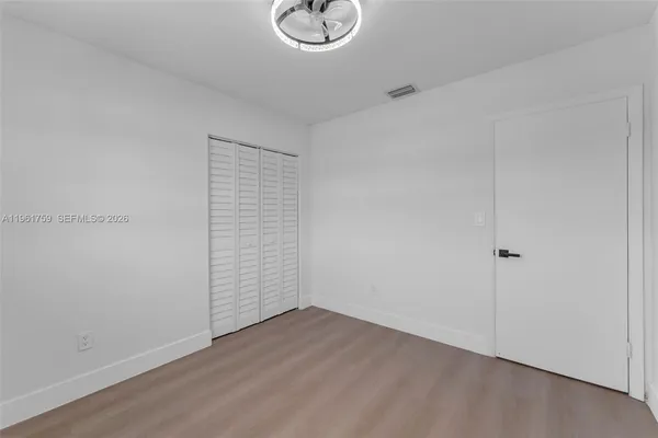 a bathroom with a double vanity sink toilet and a mirror