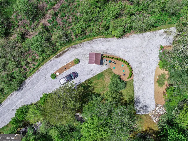 an aerial view of a house a yard