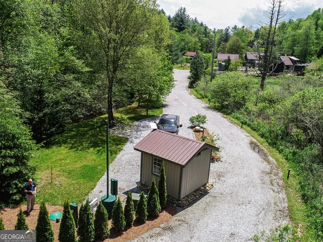 a aerial view of a house with a yard