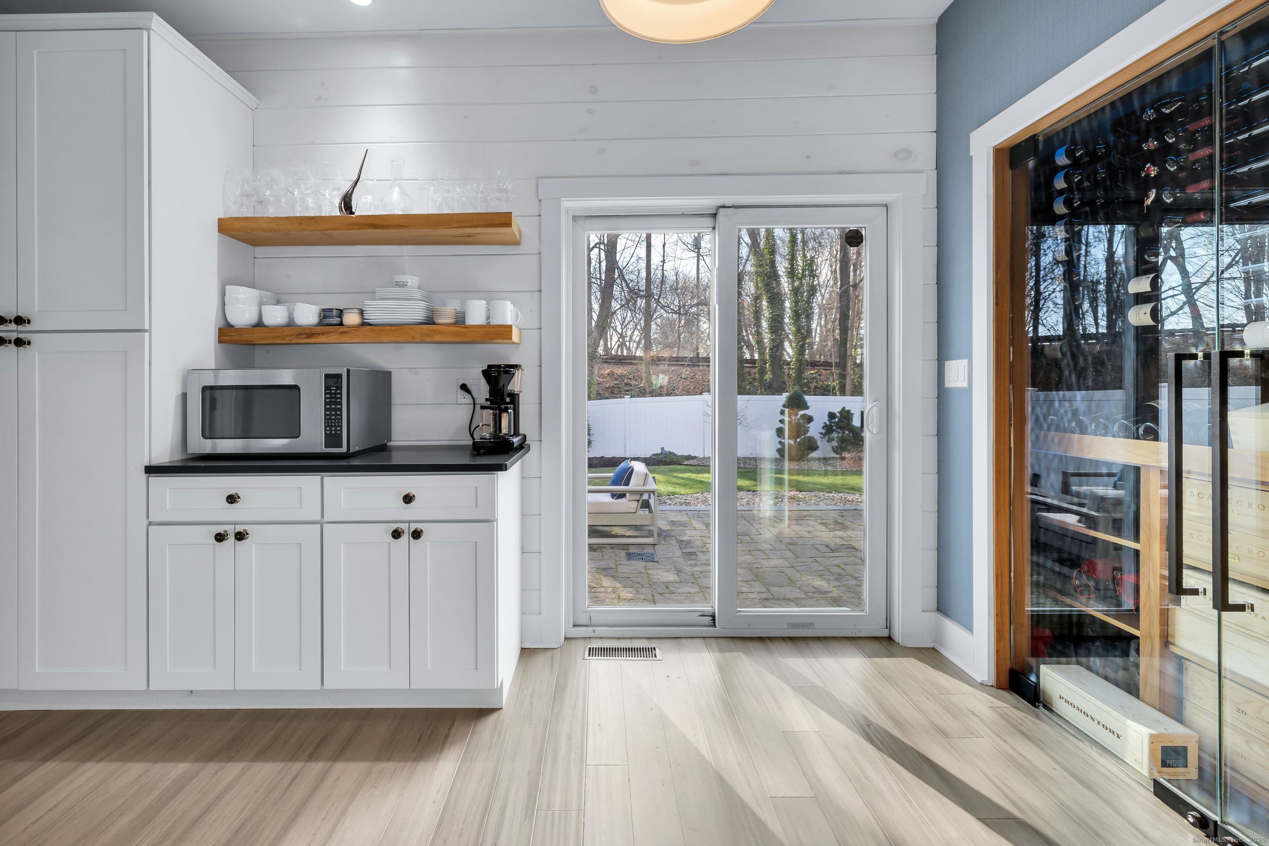 285 Old Whitfield Street Guilford, CT 06437 - Photo 11 of 40 Just past the kitchen, custom built-ins enhance the space with a pantry, breakfast/dry bar, and a temperature-controlled wine cellar.