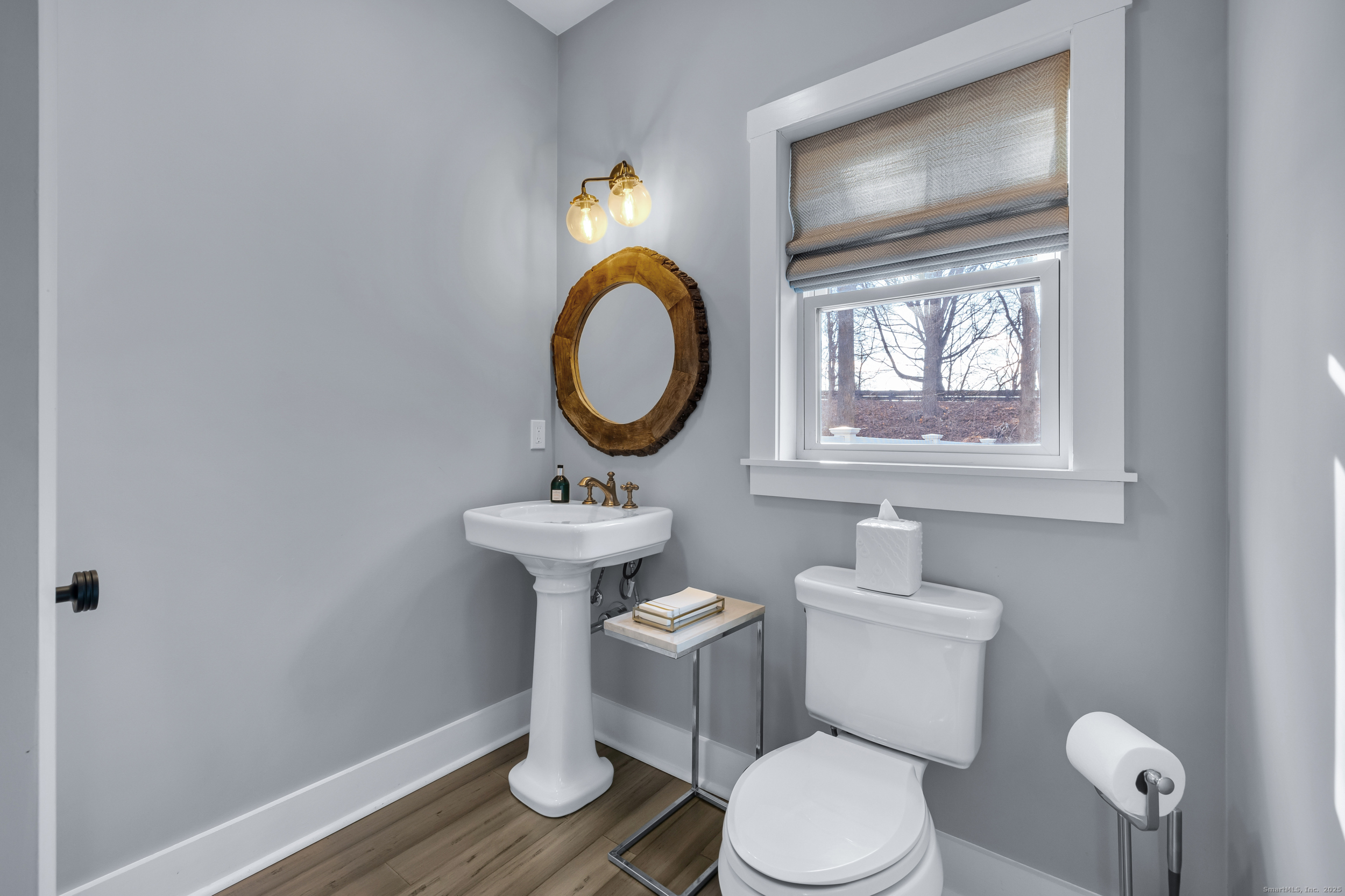 285 Old Whitfield Street Guilford, CT 06437 - Photo 14 of 40 Powder room/half bath on main level, also with bamboo flooring, and a large linen closet.