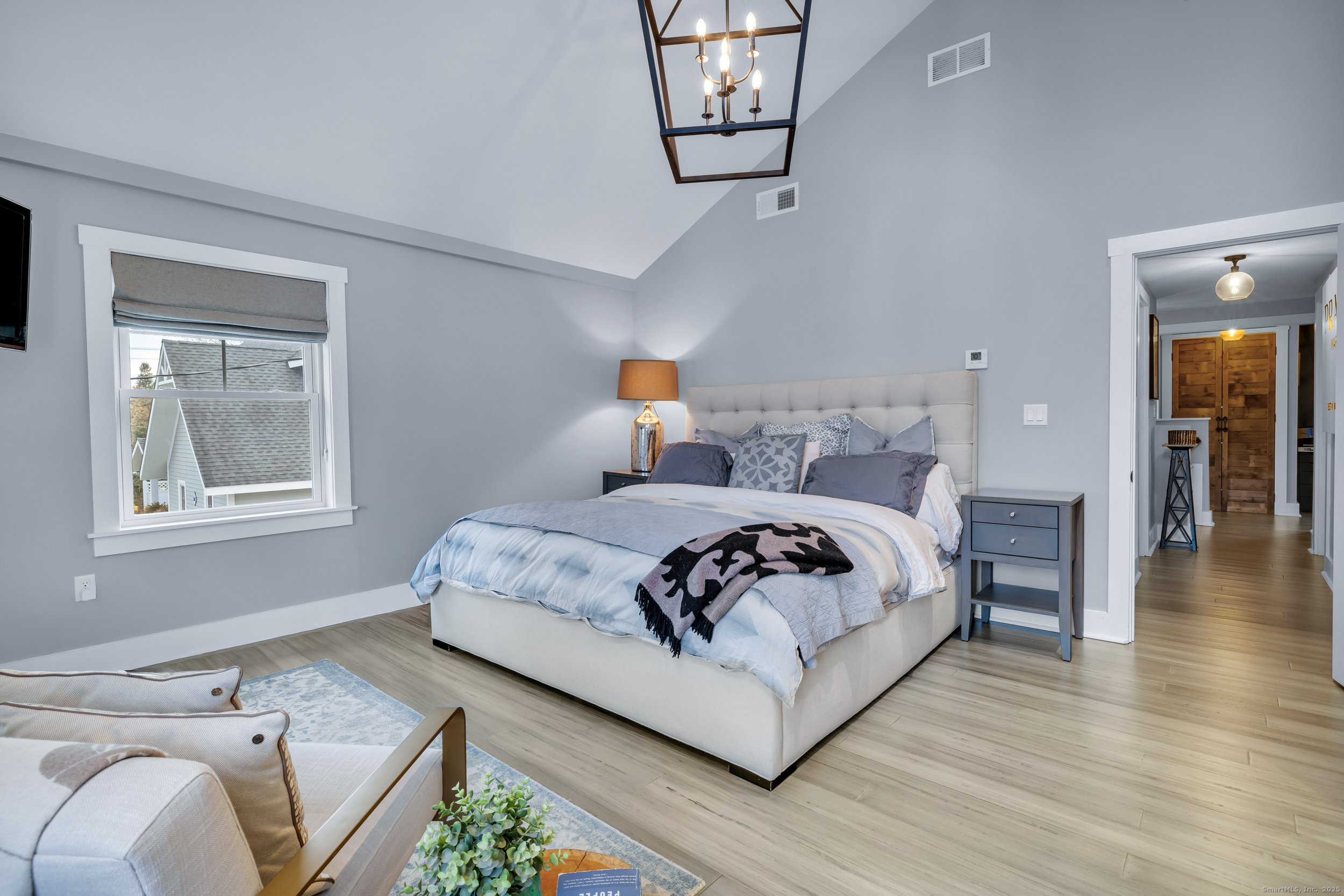 285 Old Whitfield Street Guilford, CT 06437 - Photo 15 of 40 Enjoy a spacious master bedroom with high cathedral ceilings, private balcony, full bath, and a walk-in closet with built-ins.