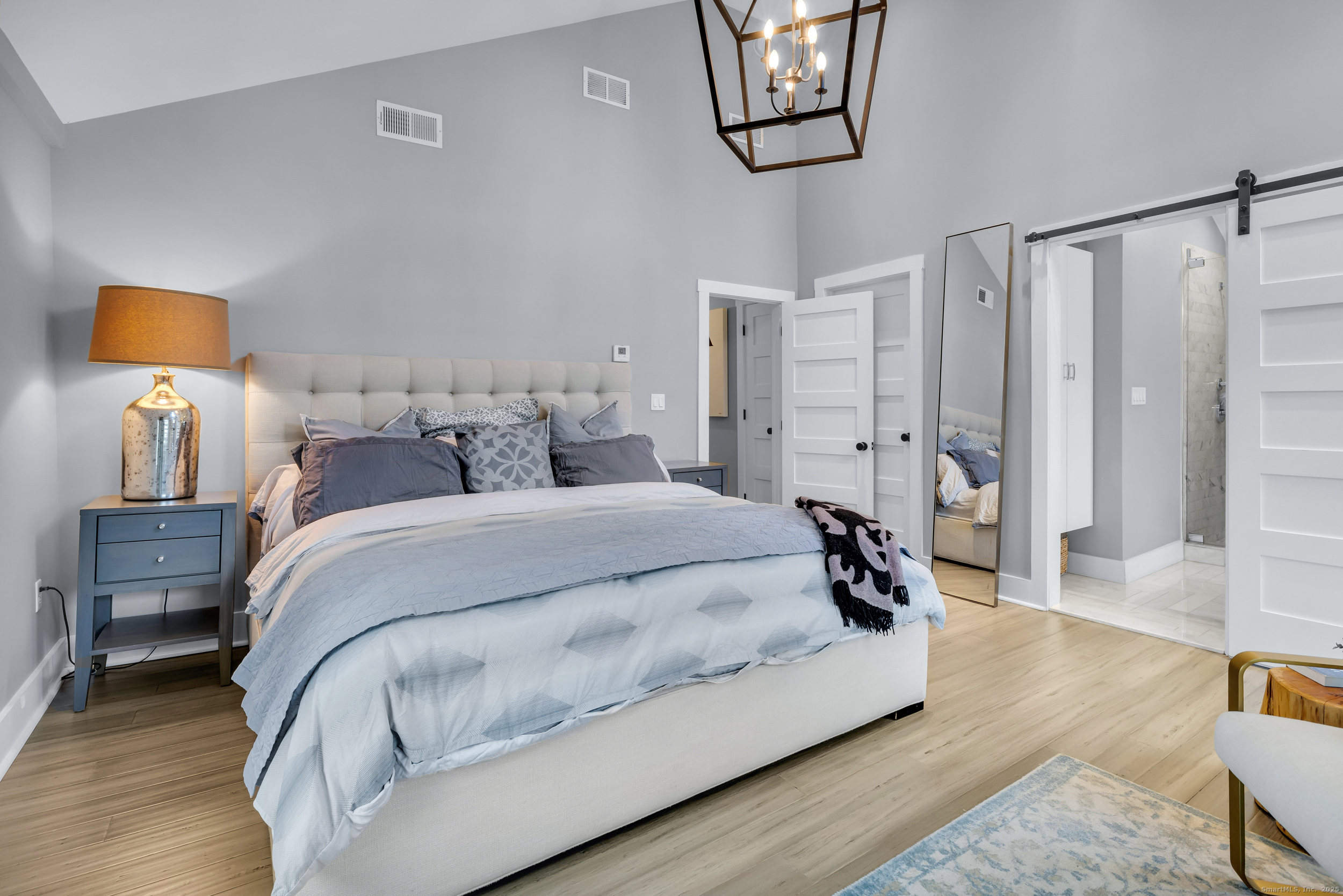 285 Old Whitfield Street Guilford, CT 06437 - Photo 17 of 40 Master bedroom also features bamboo flooring. Barn door opens to the master bath.