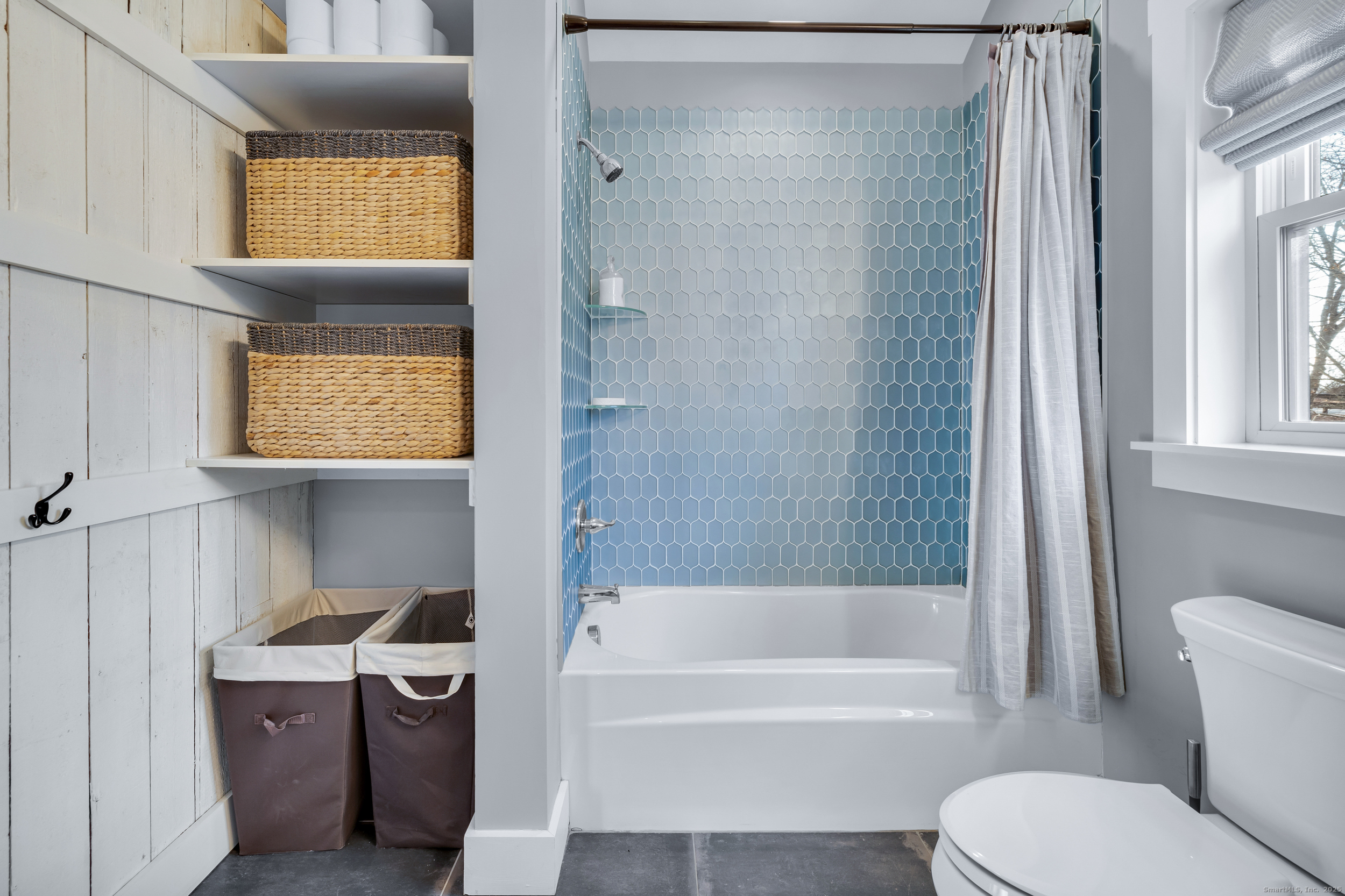 285 Old Whitfield Street Guilford, CT 06437 - Photo 23 of 40 Lovely designer tile, combination tub/shower with tile surround, and rustic wood panel wall accent.