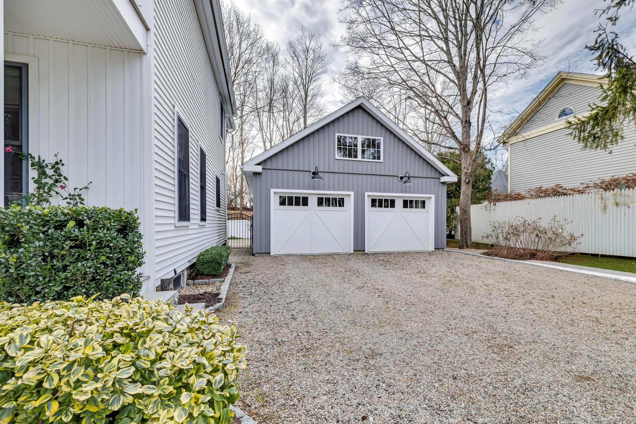 285 Old Whitfield Street Guilford, CT 06437 - Photo 28 of 40 Two-car detached garage features high ceilings and electric door openers-ideal for parking, storage, or a workshop.