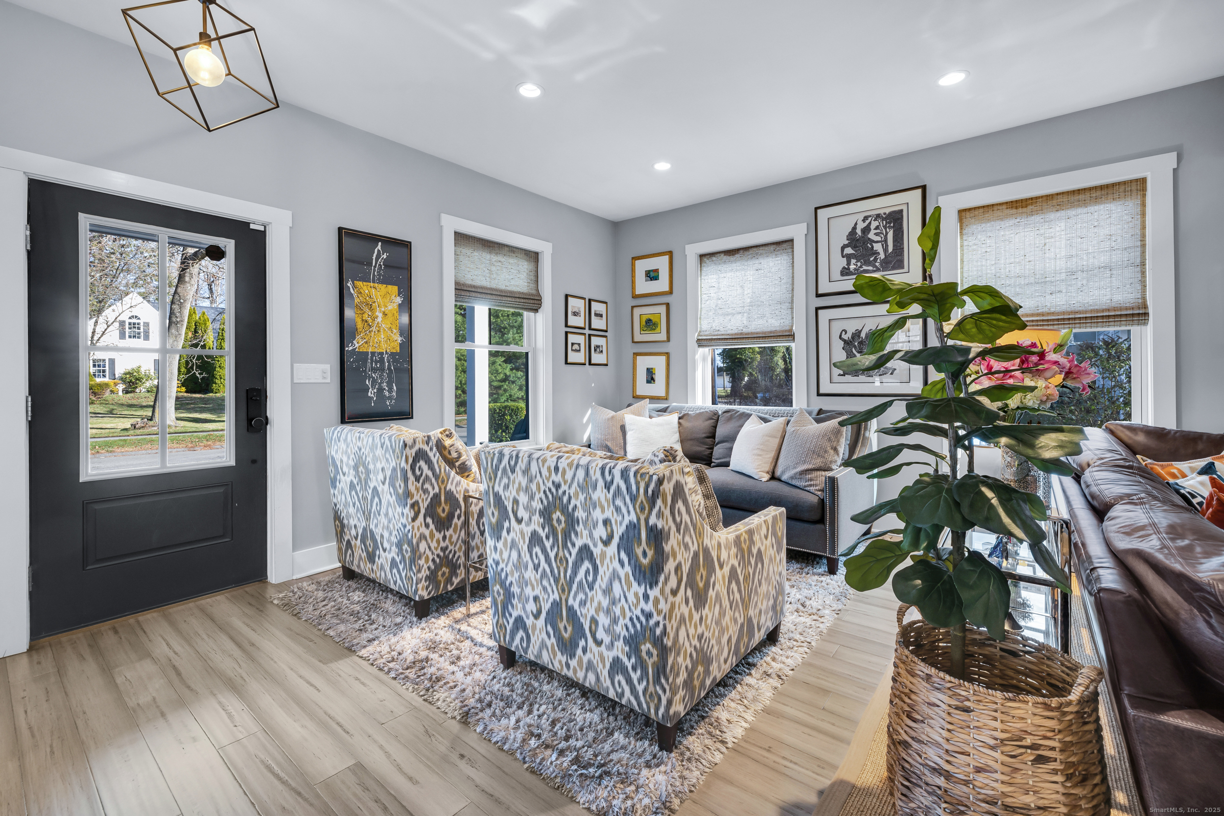 285 Old Whitfield Street Guilford, CT 06437 - Photo 36 of 40 Enter into a light-filled, open floor plan featuring beautiful bamboo flooring that extends seamlessly across both levels.