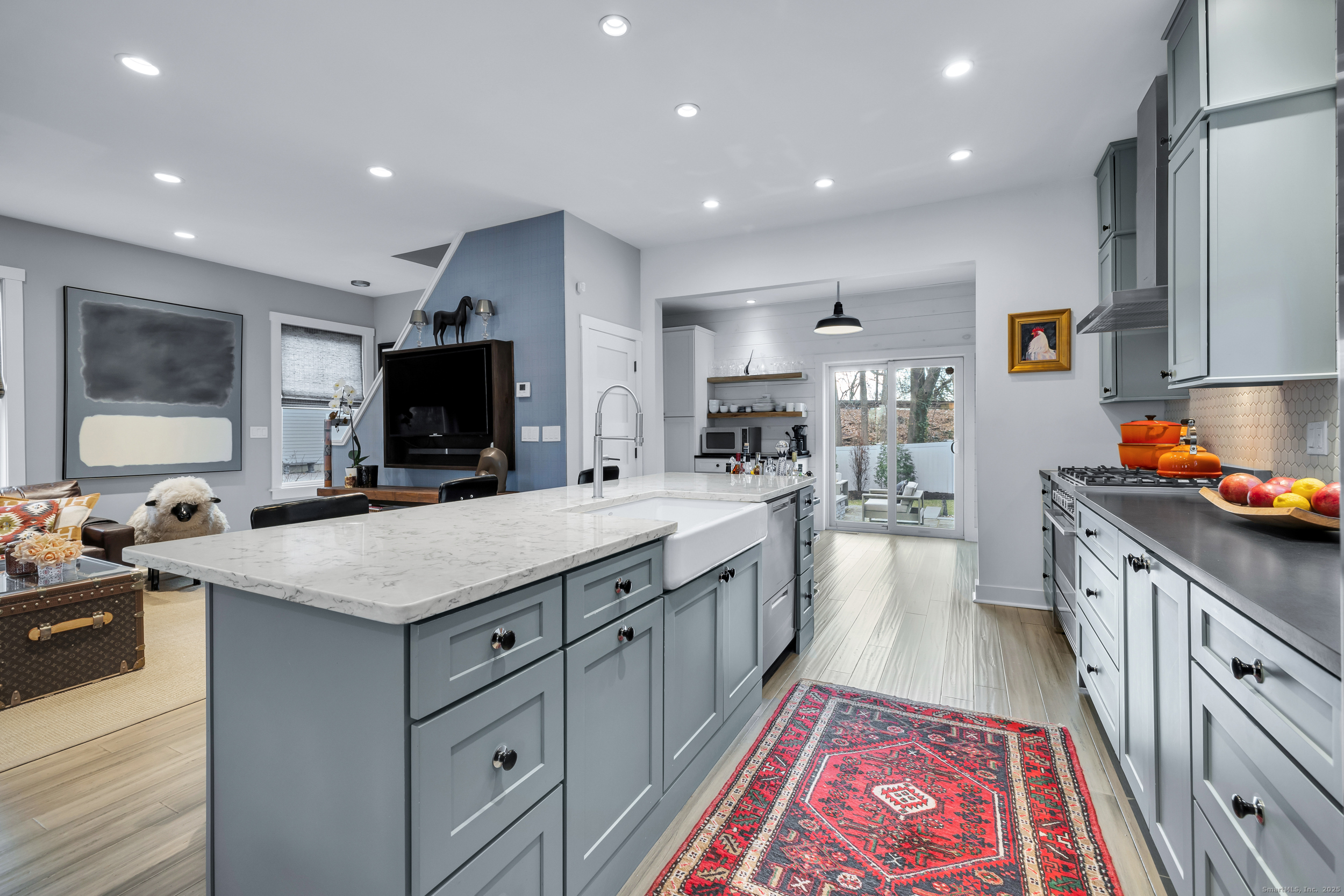 285 Old Whitfield Street Guilford, CT 06437 - Photo 8 of 40 The kitchen showcases high-end Fisher & Paykel appliances, natural stone countertops, an island with a large farm sink, and cabinetry featuring dovetail construction and soft-close hardware.