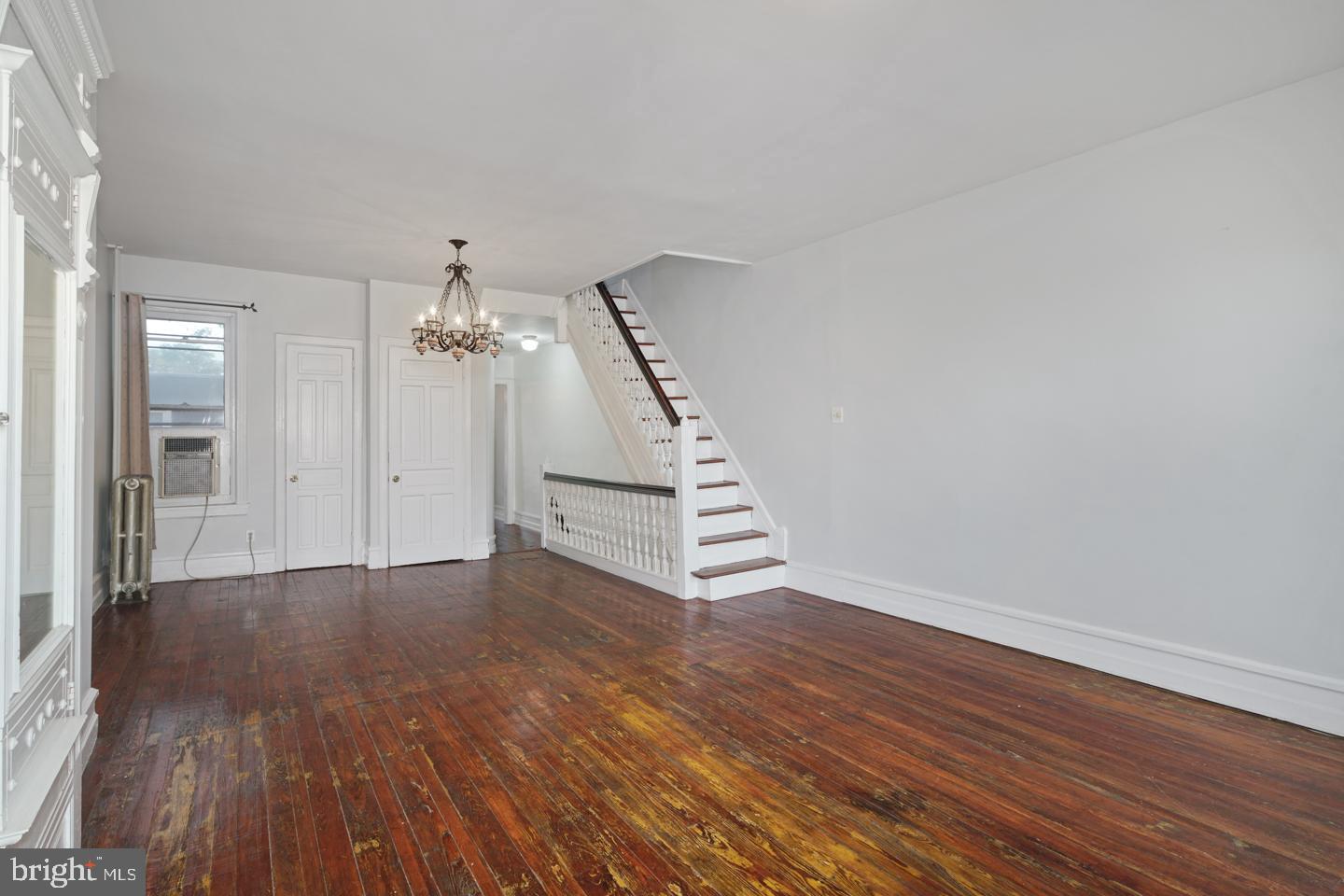 2324 Poplar Street, Unit 2F Philadelphia, PA 19130 - Photo 11 of 24 a view of an empty room with wooden floor and stairs