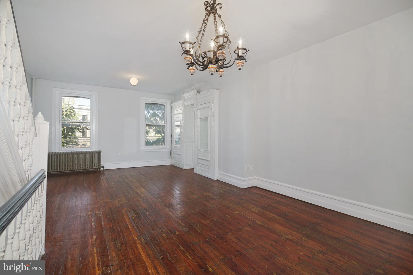 2324 Poplar Street, Unit 2F Philadelphia, PA 19130 - Photo 12 of 24 wooden floor in an empty room with a window
