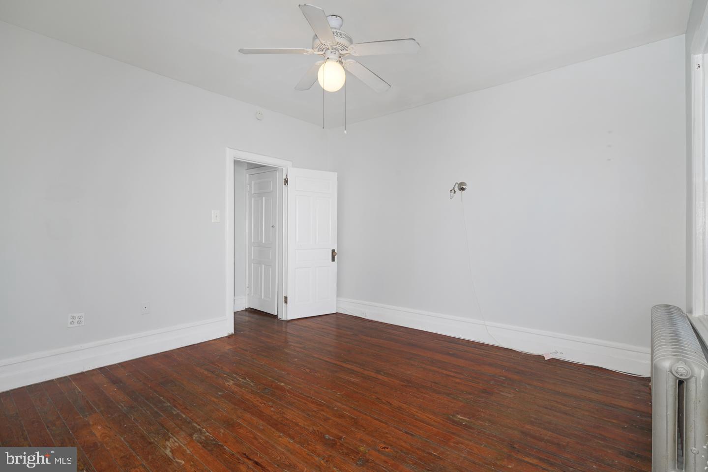 2324 Poplar Street, Unit 2F Philadelphia, PA 19130 - Photo 16 of 24 a view of an empty room with wooden floor