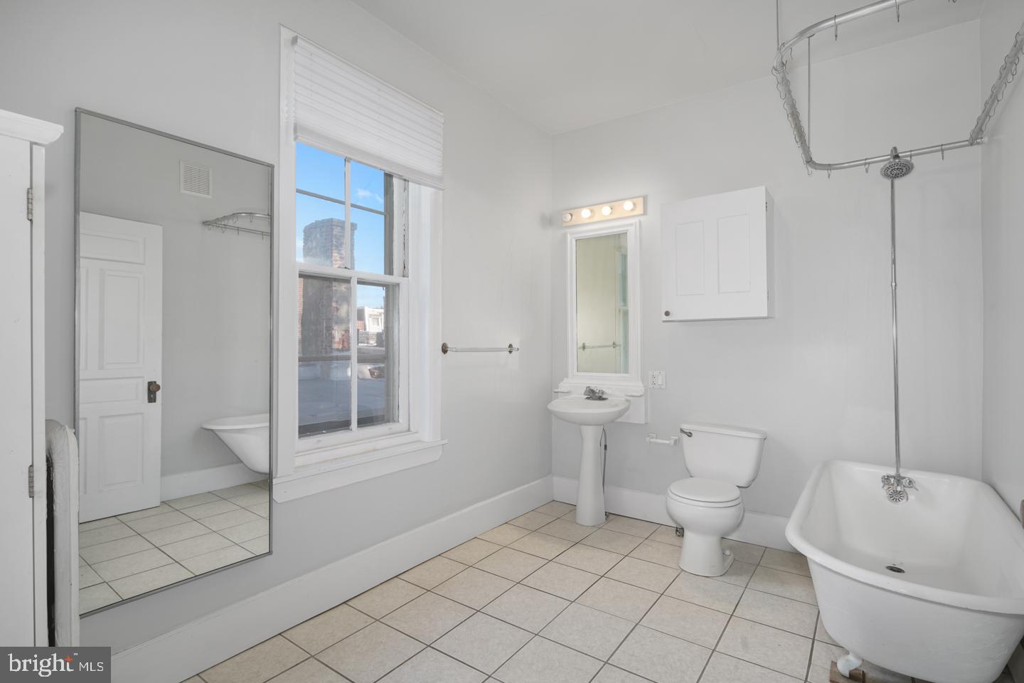 2324 Poplar Street, Unit 2F Philadelphia, PA 19130 - Photo 19 of 24 a bathroom with a toilet sink and shower