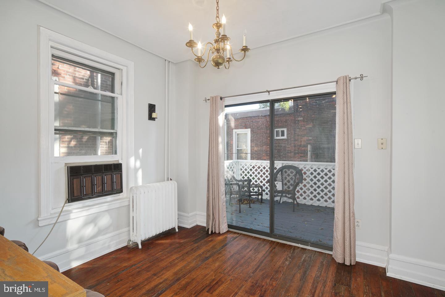 2324 Poplar Street, Unit 2F Philadelphia, PA 19130 - Photo 7 of 24 a living room with furniture and a fireplace
