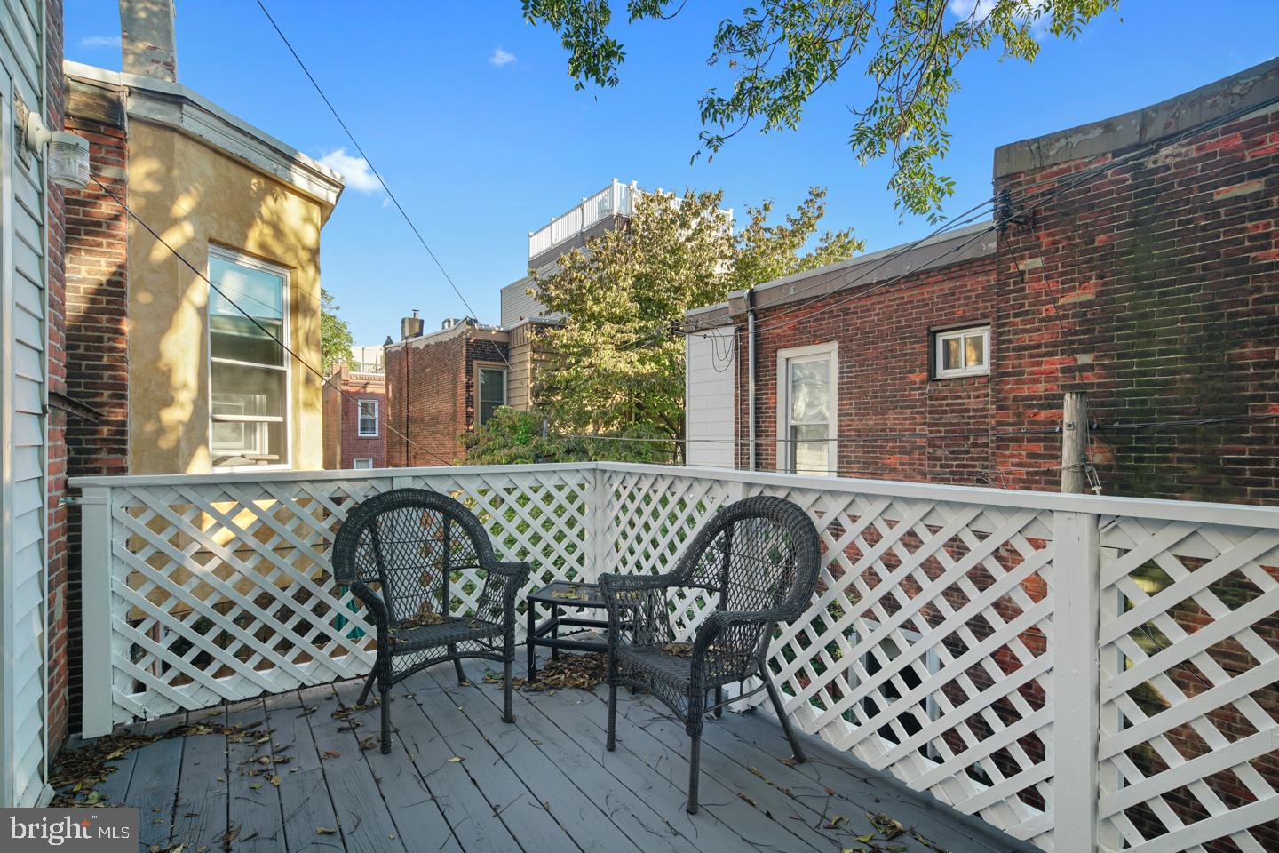 2324 Poplar Street, Unit 2F Philadelphia, PA 19130 - Photo 8 of 24 a view of a chairs and table on the deck
