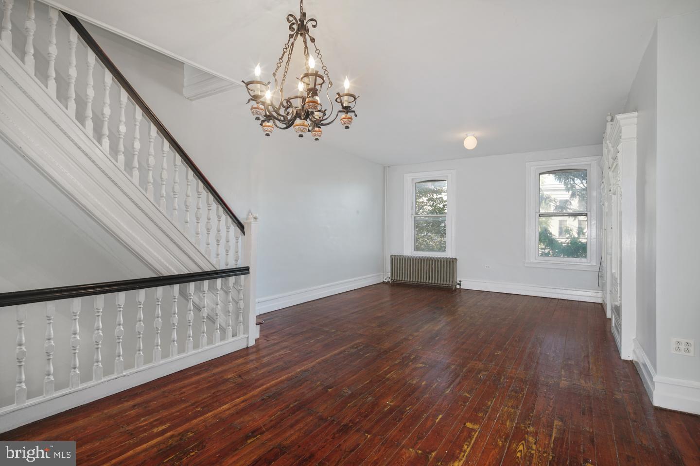 2324 Poplar Street, Unit 2F Philadelphia, PA 19130 - Photo 10 of 24 a view of an empty room with wooden floor and a window