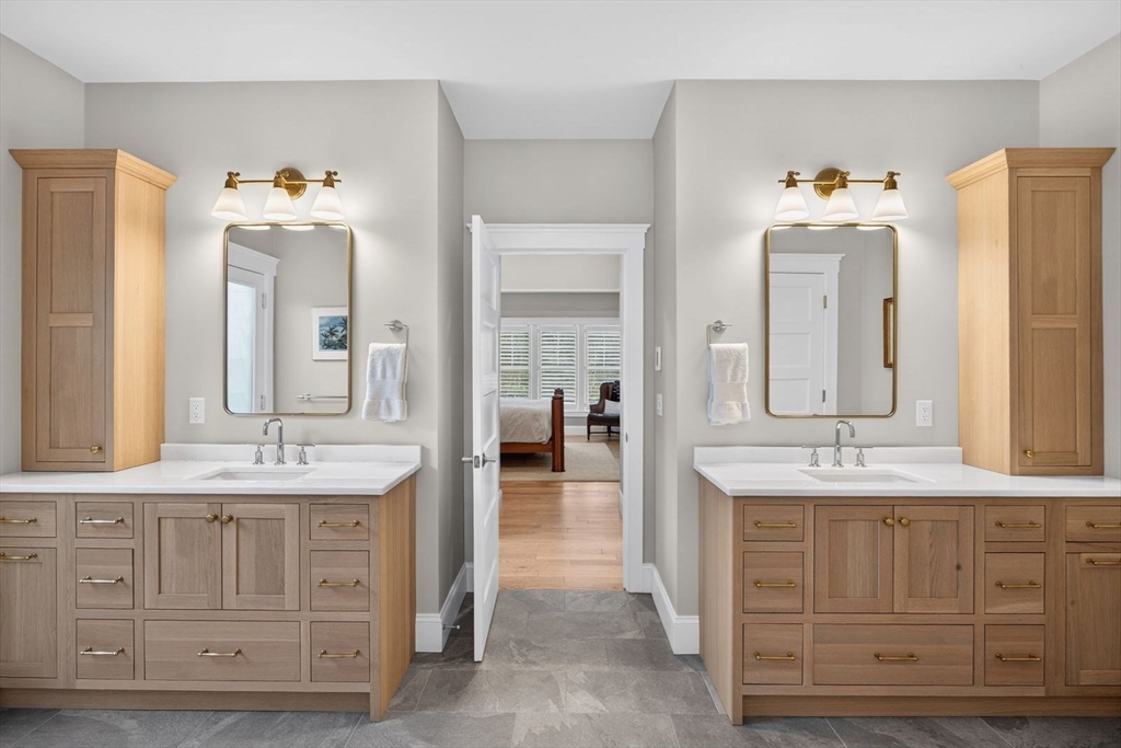 12 Talcott Pines Road Plymouth, MA 02360 - Photo 16 of 41 a en suite bathroom with a double vanity sink and a mirror